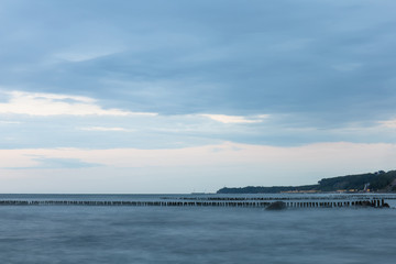 the lights of a small town by the sea in the evening on a long exposure