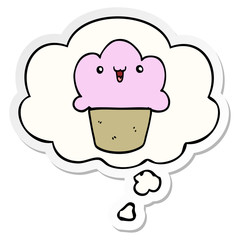 cartoon cupcake with face and thought bubble as a printed sticker