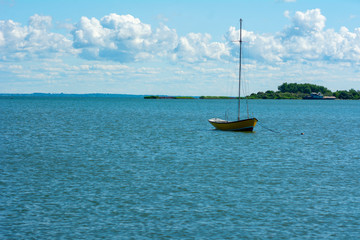 Obraz premium Old wooden fishing boat trawler on sea.