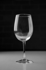 Empty wine glass on marble table top.