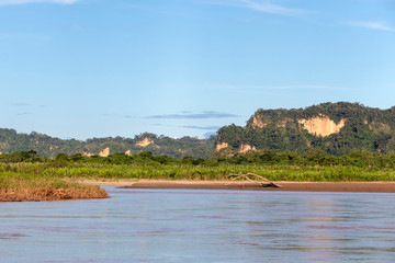 Sunset at Beni river cliffs, adventure in jungles of Madidi national park, Amazon river basin in Bolivia, South America