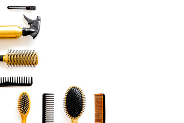 Hairdresser equipment for cutting hair and styling with combs, sciccors on white background top view copyspace
