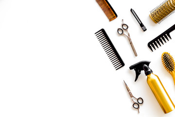 Combs, spray and hairdresser tools in beauty salon work desk on white background top view mockup