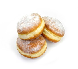 Obraz na płótnie Canvas German doughnut berliner with icing sugar isolated on white. Donuts(Sufganiyah) isolated on white background one fresh baked with powered sugar. fresh dough-nut with jam. Serbian krofna