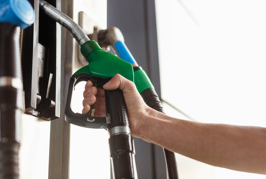 Crop Hand Taking Green Fuel Dispenser