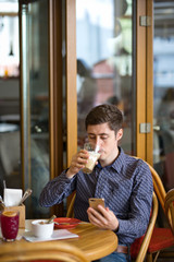 man with coffee and smartphone