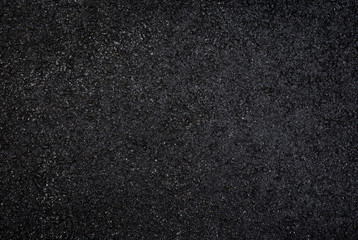 High resolution full frame textured dark background of wet, black asphalt, viewed from above. - obrazy, fototapety, plakaty