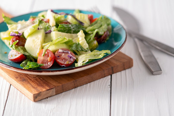 Fresh garden salad on a farmhouse table