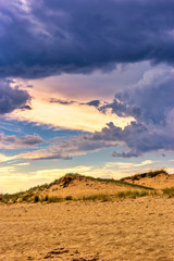 Sunlight in stormy cloudy sky on the beach