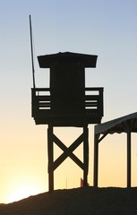 Sunset at the beach in the afternoon with vigilance tower