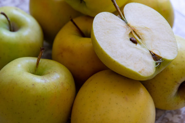 apples on a plate on the table in the kitchen. Chantecler apples.