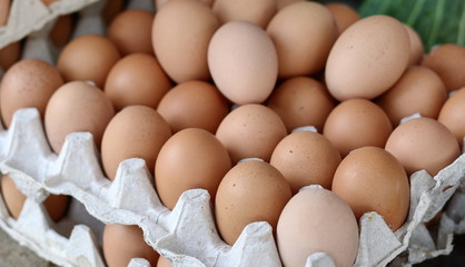 Eggs in the paper package. Fresh eggs at the market. Selling Fresh Chicken Eggs at Local Farmer Market. Fresh chicken eggs for sale at a market place. 
