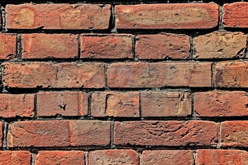 Distress old brick wall texture. Brick orange color background. Background brick texture. Design on the street. Old dirty brick with damage.