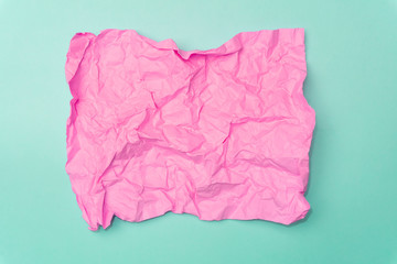 Crumpled paper minimal concept. Сolored paper on a colored background.