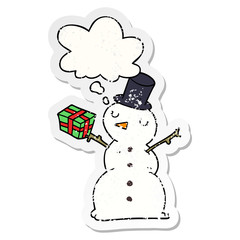 cartoon snowman and thought bubble as a distressed worn sticker