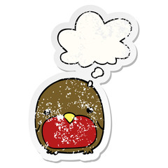 cute cartoon penguin and thought bubble as a distressed worn sticker