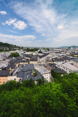Fototapeta na wymiar Views of the Austrian ancient city of Salzburg. Mozart's hometown. roofs, parks and architecture in summer