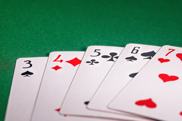 playing cards on the green table. Combination 