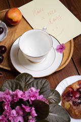 happy  morning . life style shot morning tea with  berry cake, fruits and african violet flower