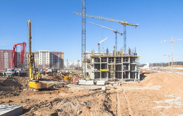  Construction area with yellow cranes at summer time.  