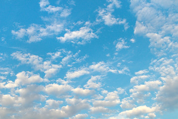 textured small clouds in the blue sky