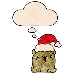cute cartoon bear with christmas hat and thought bubble in grunge texture pattern style