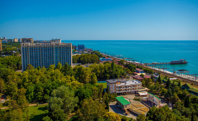 Fototapeta na wymiar Beautiful panoramic autumn landscape at the resort city of Sochi on the Black sea coast. The view from the top.