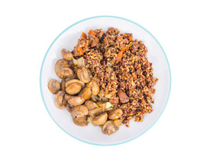 Vegetarian menu, red rice with champignons.