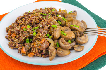 Vegetarian menu, red rice with champignons.