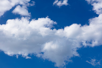 Blue skies white fluffy clouds