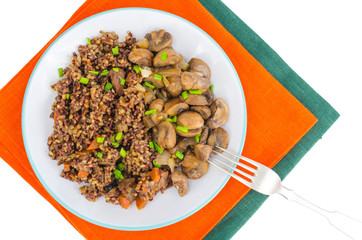 Vegetarian menu, red rice with champignons.