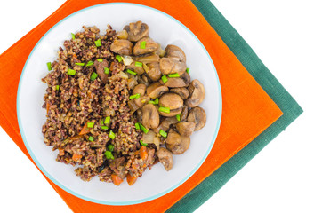 Vegetarian menu, red rice with champignons.