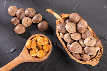 Plukenetia volubilis - Dried seeds of sacha fruit. Inchi peanuts. White background