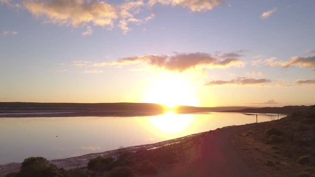 Aerial view of the Pink Lake in south west Australia. The pink lake reflects the red Australian desert sun in its clear water