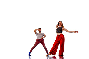 Fototapeta na wymiar Two talented breakdancers practicing together isolated on white