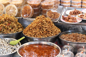 Varieties of  dried foods such as crispy fish,shredded pork and pickled​ cockles shell for sale at fresh market in Bangkok ,Thailand