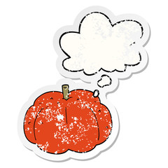 cartoon pumpkin and thought bubble as a distressed worn sticker
