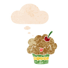 cartoon cupcake and thought bubble in retro textured style