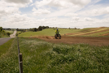 Obraz premium Moto Cross racing on a rural farm