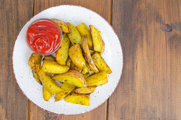 Baked potato wedges with country style herbs on plate