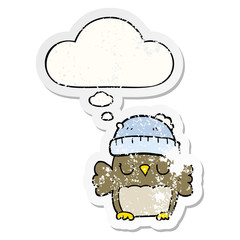 cute cartoon owl in hat and thought bubble as a distressed worn sticker