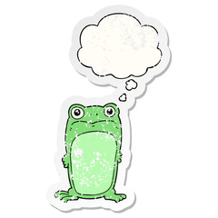cartoon staring frog and thought bubble as a distressed worn sticker