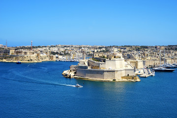 Fototapeta premium high angle sunny cityscape view of Mediterranean island Malta over blue sky