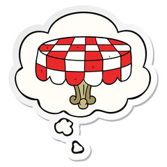 cartoon table and thought bubble as a printed sticker