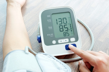 Man check blood pressure monitor and heart rate monitor with digital pressure gauge. Health care...