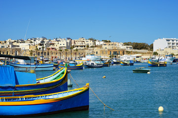 Naklejka na ściany i meble close up colorful traditional wooden fishing boats in harbor of Mediterranean island Malta