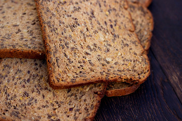 Bread slices on wooden oak table