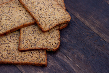 Bread slices on wooden oak table