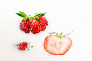 Red natural ripe strawberries in milk cream