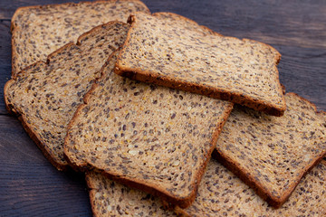 Bread slices on wooden oak table